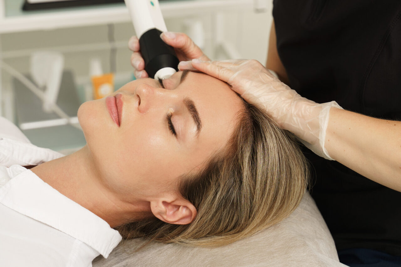 Woman during carbon dioxide laser resurfacing in a cosmetology c
