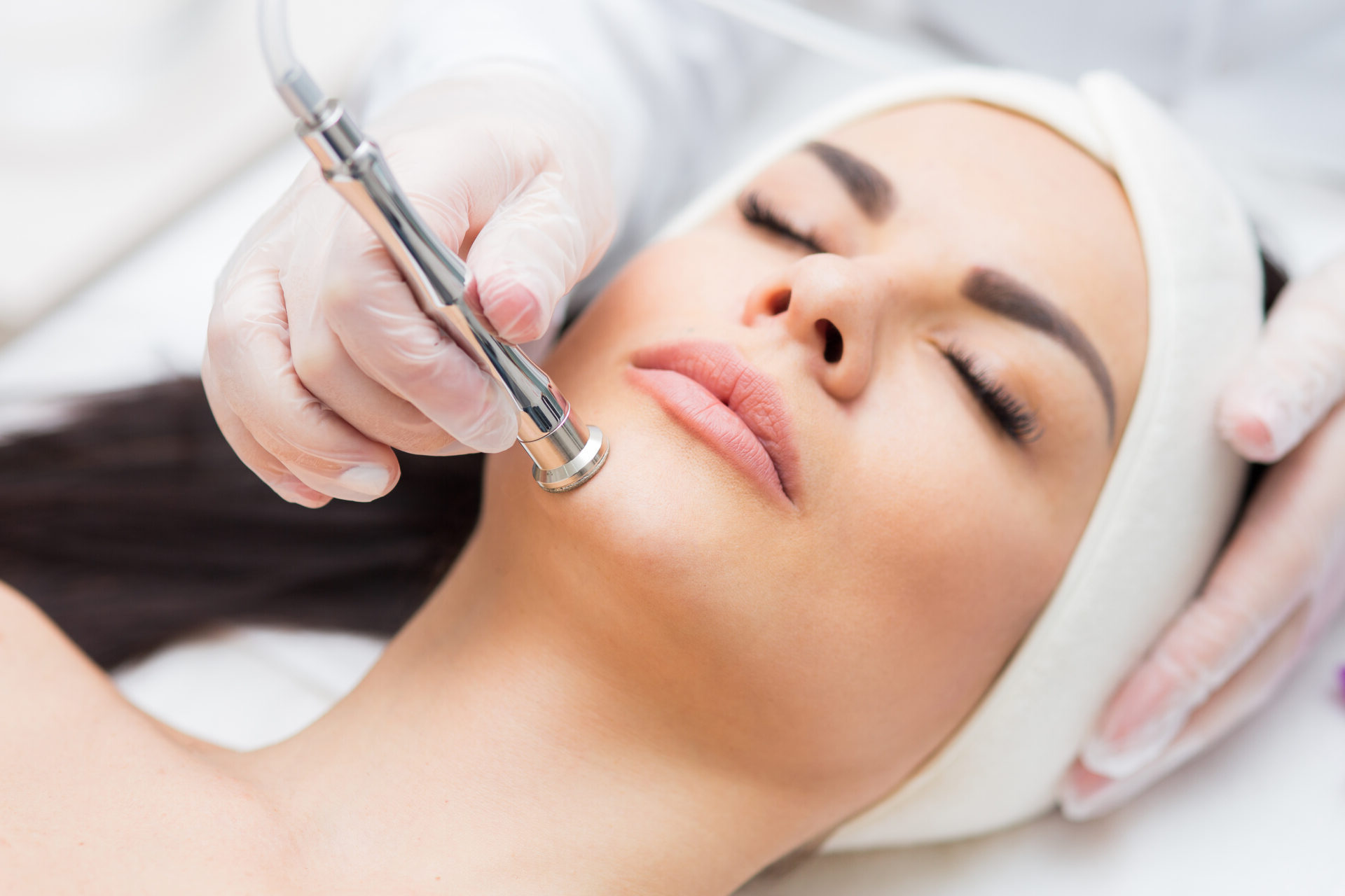 portrait of a woman receiving diamond microdermabrasion treatment