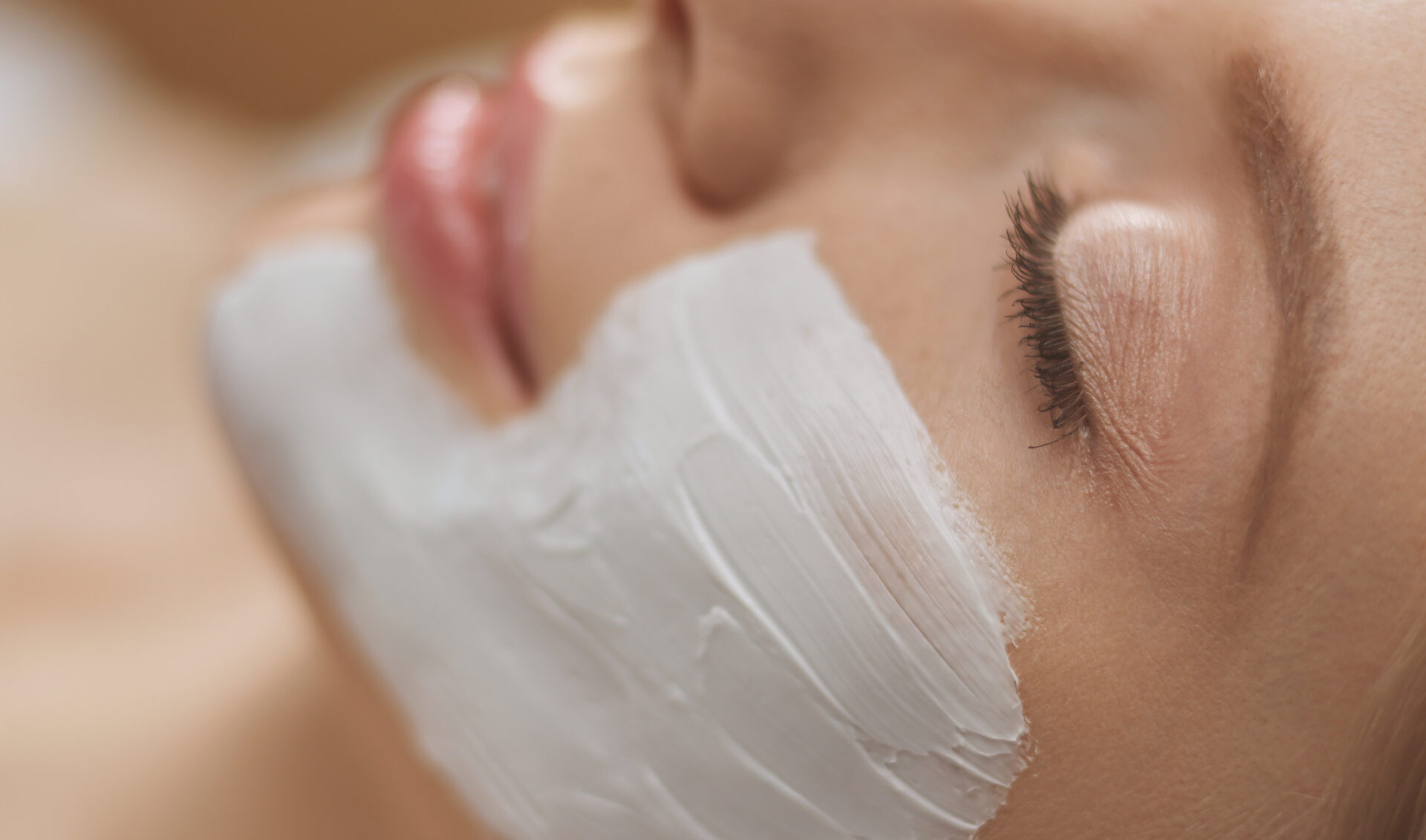 Spa facial mask application. Spa beauty organic facial mask application at day spa salon.